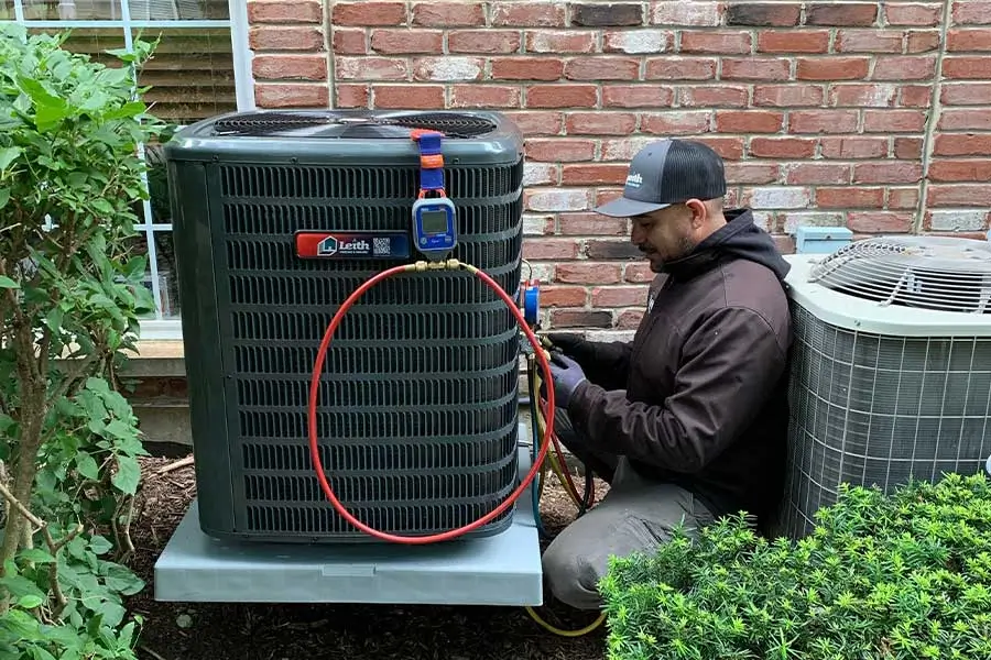 Leith Heating & Cooling technician completing AC replacement in Elgin, IL