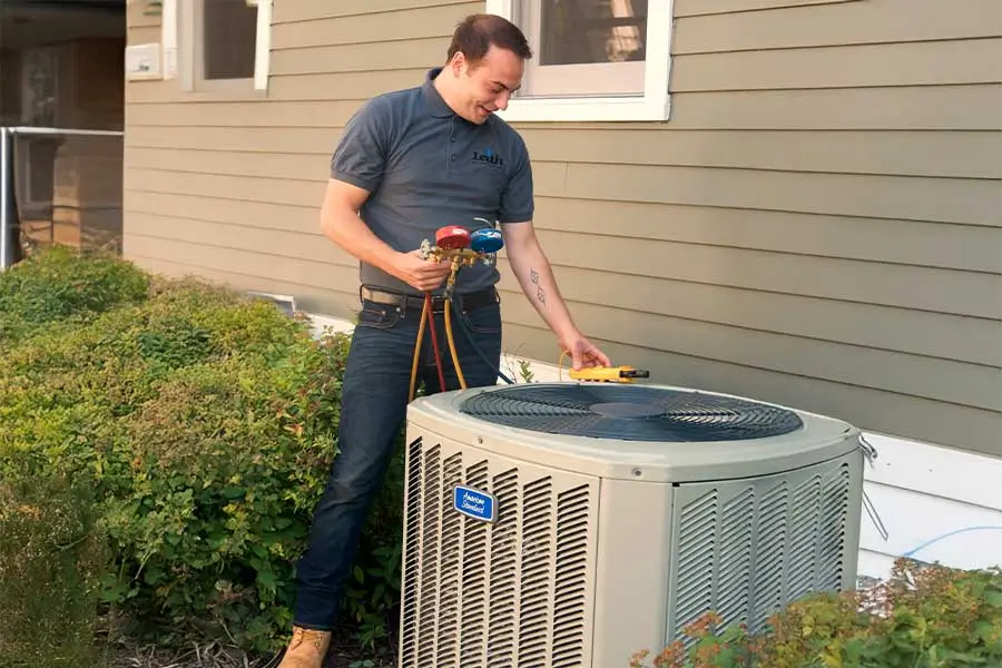 Leith Heating & Cooling technician performing AC tune up in Elgin, IL
